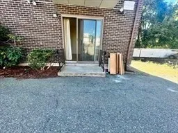 a view of a house with backyard and garden