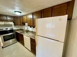 a white refrigerator freezer sitting in a kitchen