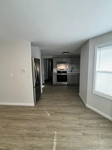 a view of living room and kitchen with furniture