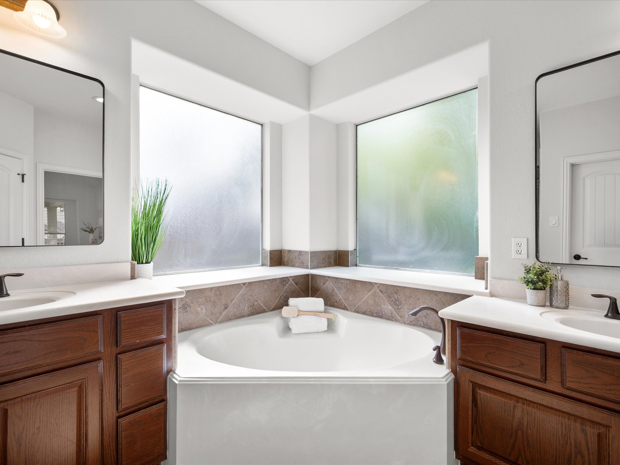 323 Arbor Ridge Lane Conroe, TX 77384 - Photo 21 of 40 That soaking tub is calling your name. Two vanities, great light, and a layout that actually makes sense for two busy people. Mornings just got smoother.