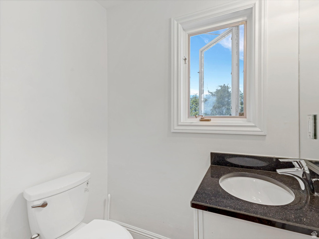 8318 Ridge Point Road Sandy, UT 84093 - Photo 17 of 46 half bath off the mudroom