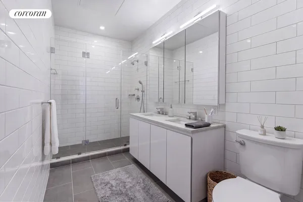 a bedroom with bed and a large window