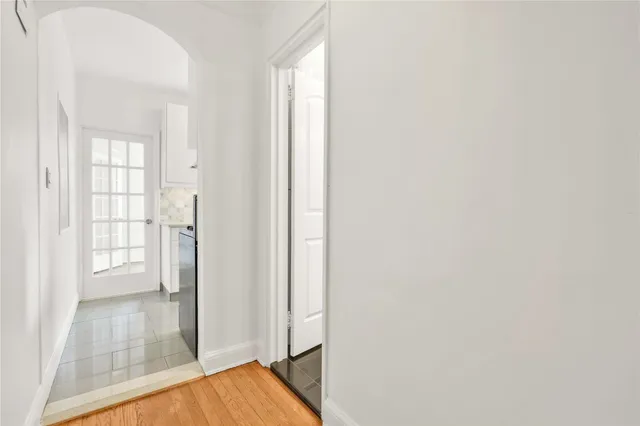 view of wooden floor and windows in a room