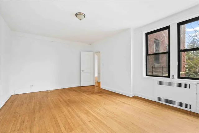 a view of an empty room with a window