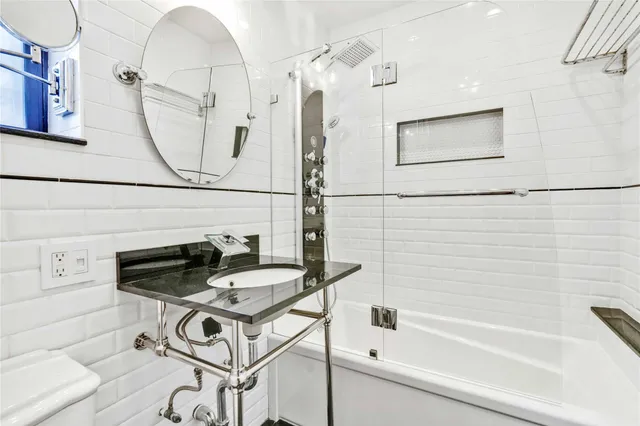 a bathroom with a bathtub and a shower