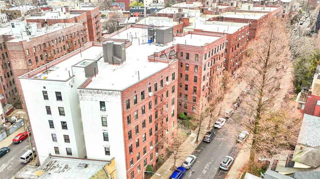 a car parked in front of a brick building