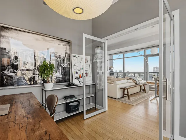 a bedroom with furniture and a window