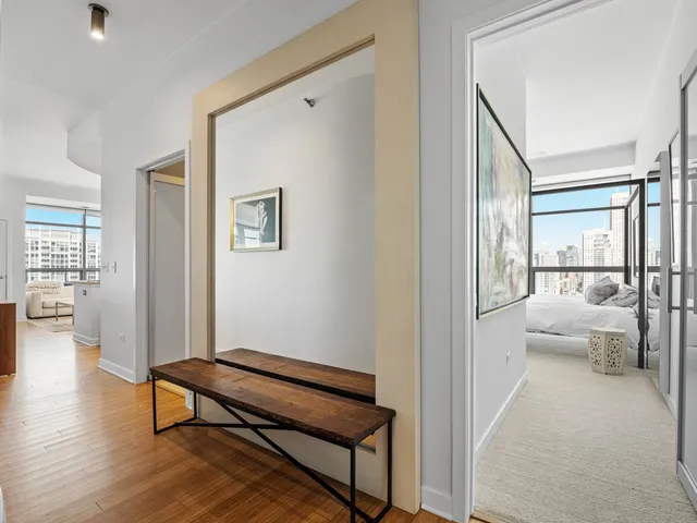 a spacious bedroom with a large bed and a large window