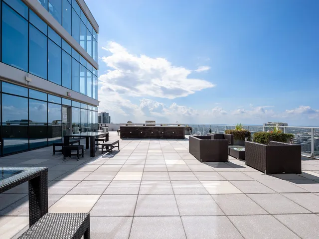 a view of a patio with table and chairs and potted plants