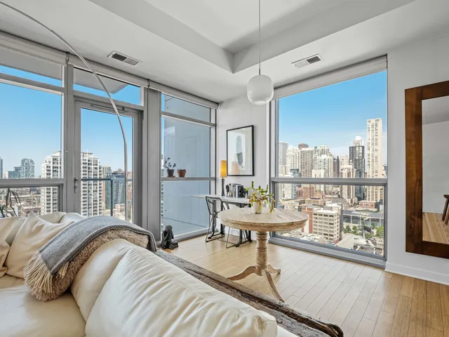 a bed room with two beds and a large window