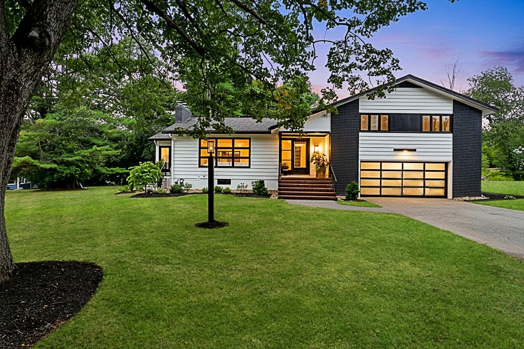 30 Linda Road Andover, MA 01810 - Photo 1 of 42 a front view of a house with a garden