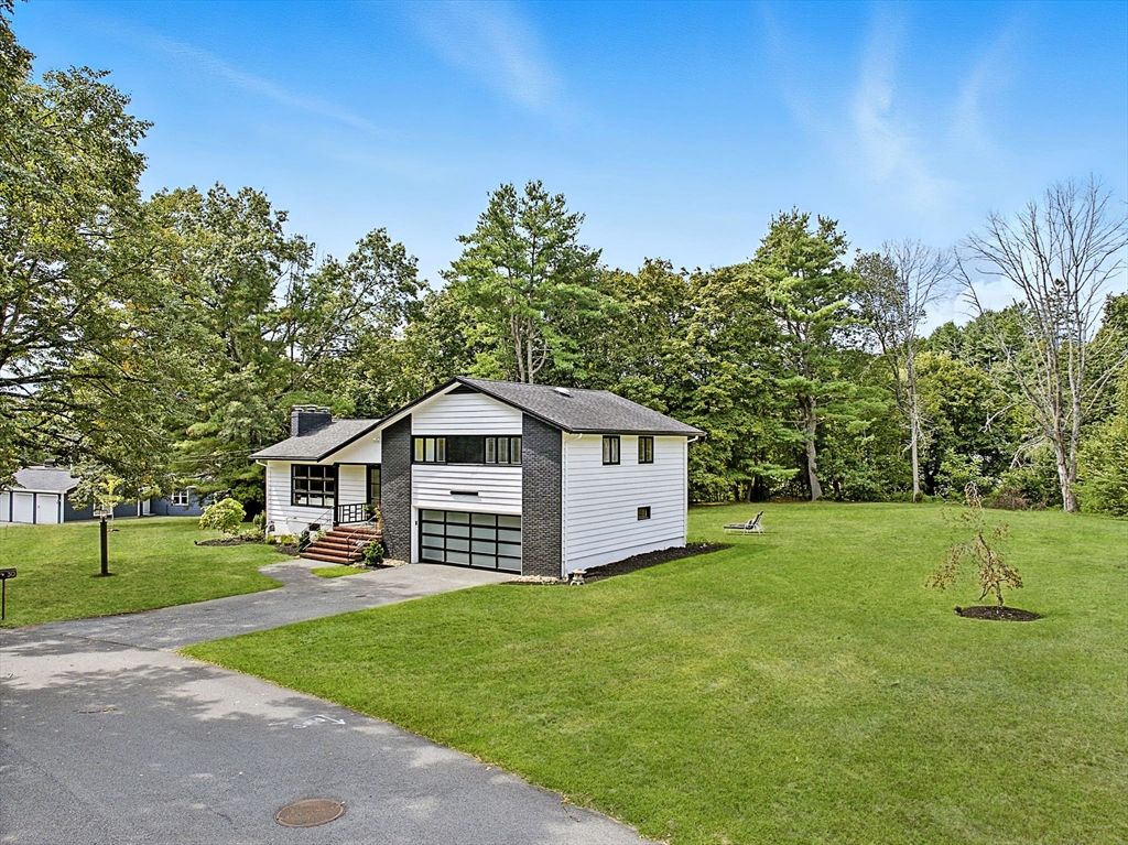 30 Linda Road Andover, MA 01810 - Photo 2 of 42 a view of a house with a big yard and large trees