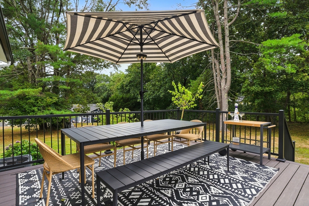 30 Linda Road Andover, MA 01810 - Photo 21 of 42 a view of a chairs and table on the deck