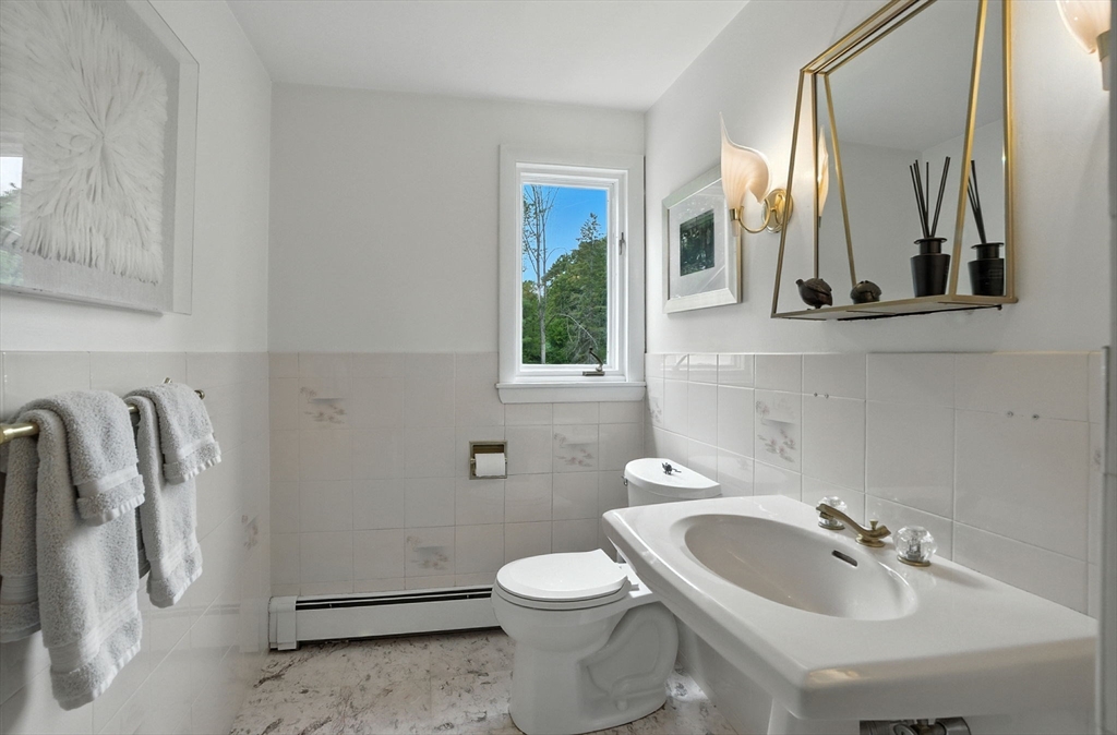 30 Linda Road Andover, MA 01810 - Photo 23 of 42 a bathroom with a sink a toilet and a mirror