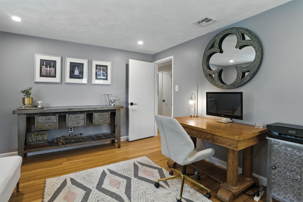 30 Linda Road Andover, MA 01810 - Photo 28 of 42 a living room with furniture and a fireplace
