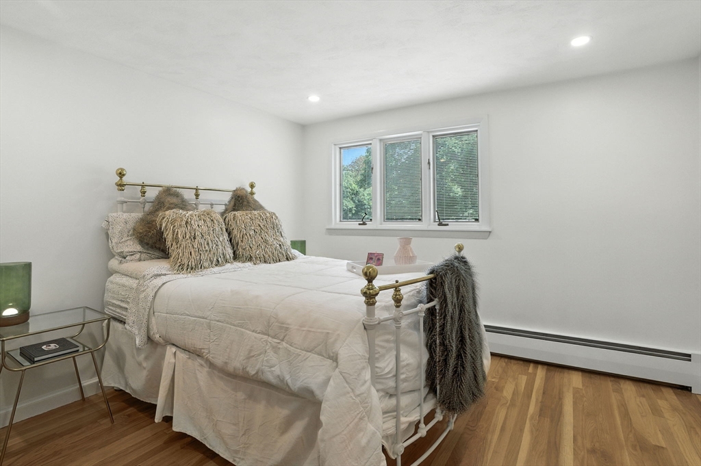 30 Linda Road Andover, MA 01810 - Photo 29 of 42 a bedroom with a bed and wooden floor