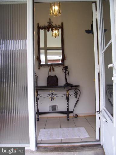 912 Hyde Road Silver Spring, MD 20902 - Photo 6 of 18 Tiled foyer floor, entrance from carport