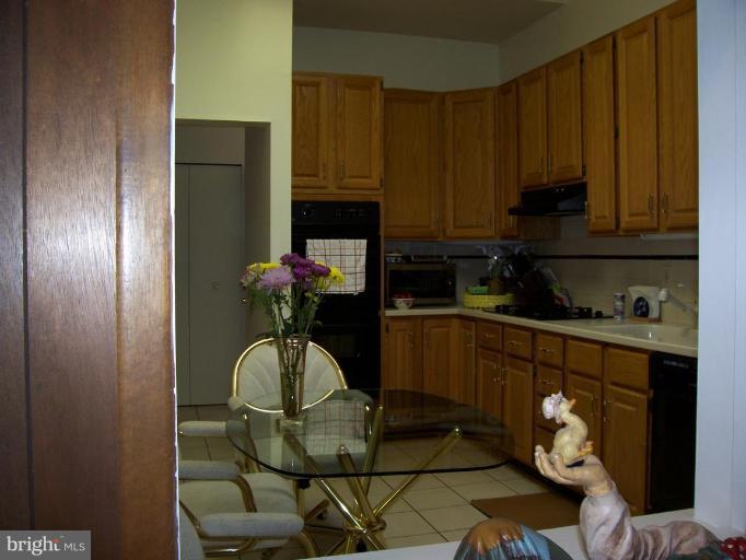912 Hyde Road Silver Spring, MD 20902 - Photo 8 of 18 Corian counter tops, sky light, cooktop, dbl oven