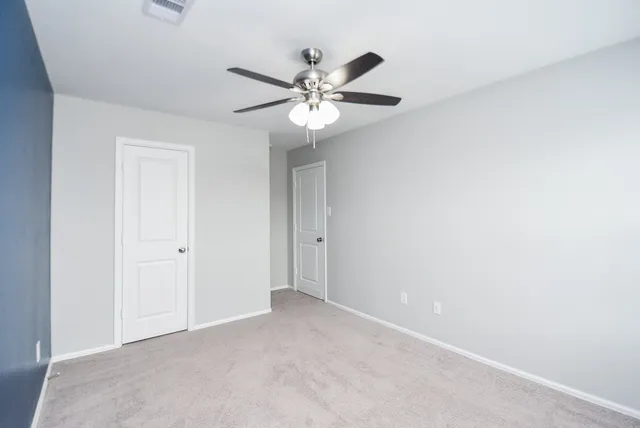 a bathroom with a sink toilet and a mirror
