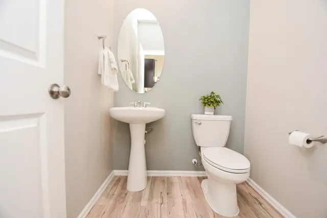 a view of a house with a garden and yard