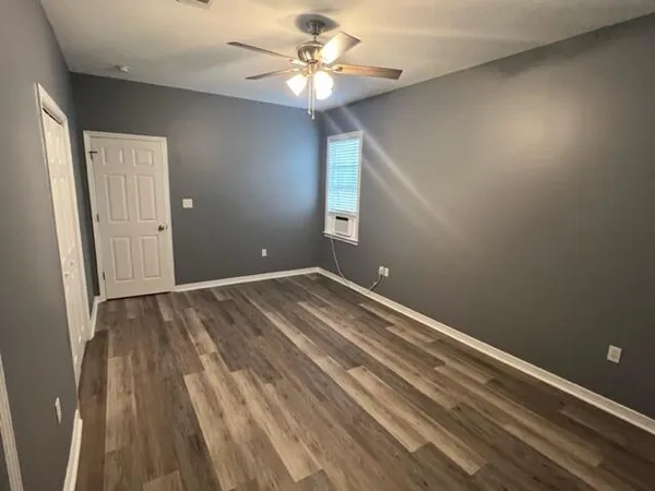 a view of room with window and ceiling fan