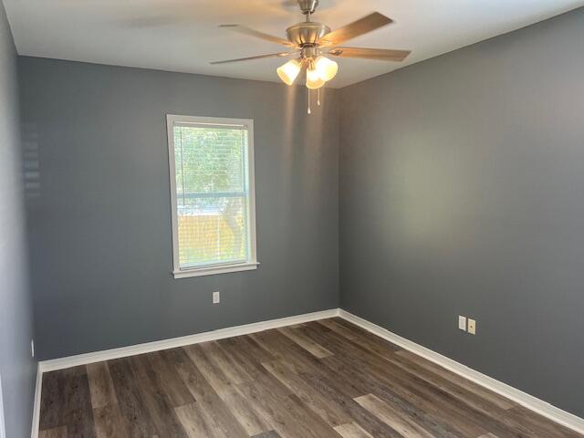 161 Walnut Street Santa Rosa Beach, FL 32459 - Photo 17 of 19 wooden floor in an empty room with a window