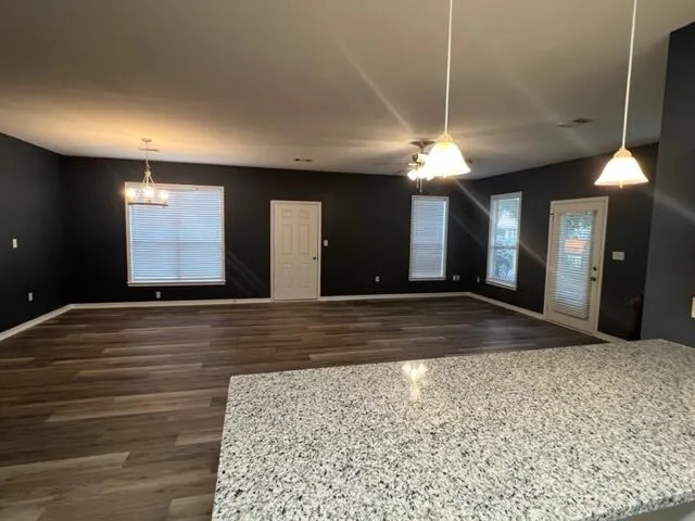 a view of a hallway with a chandelier