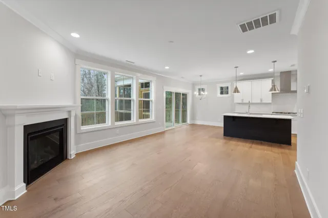 a view of a kitchen with large windows and a fireplace