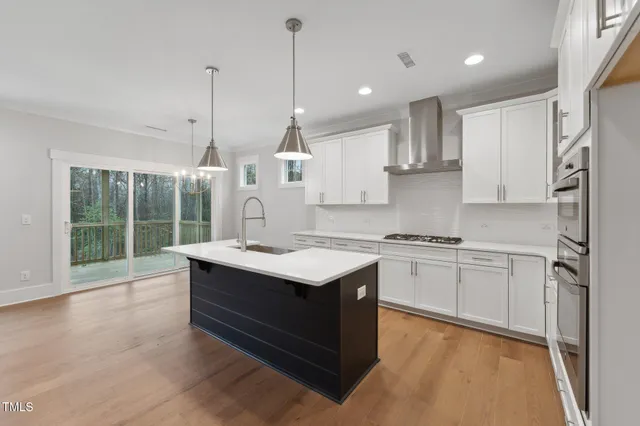 a kitchen with a stove sink and refrigerator