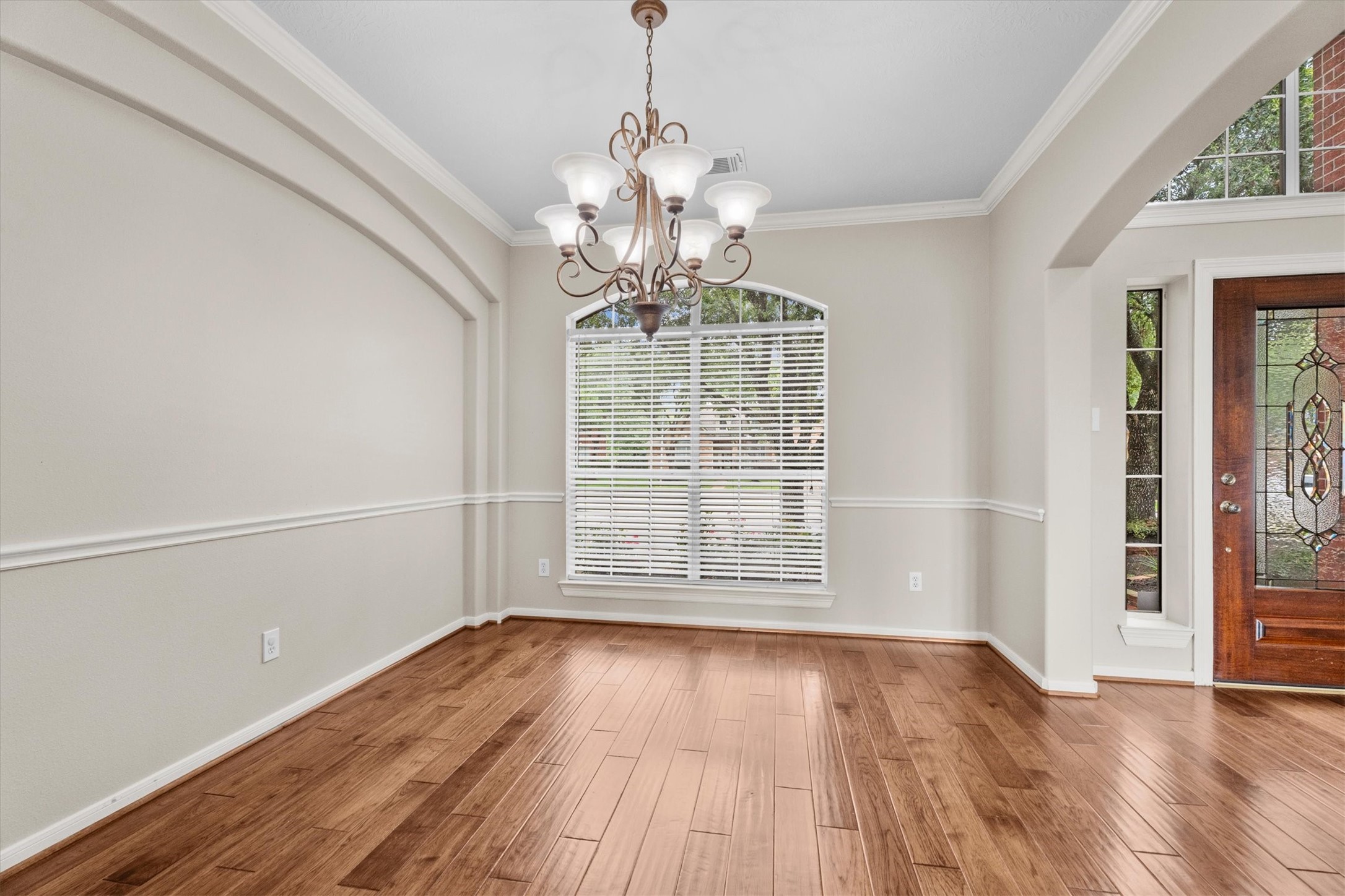 6323 Stone Trail Lane Spring, TX 77379 - Photo 8 of 43 wooden floor in an empty room with a window