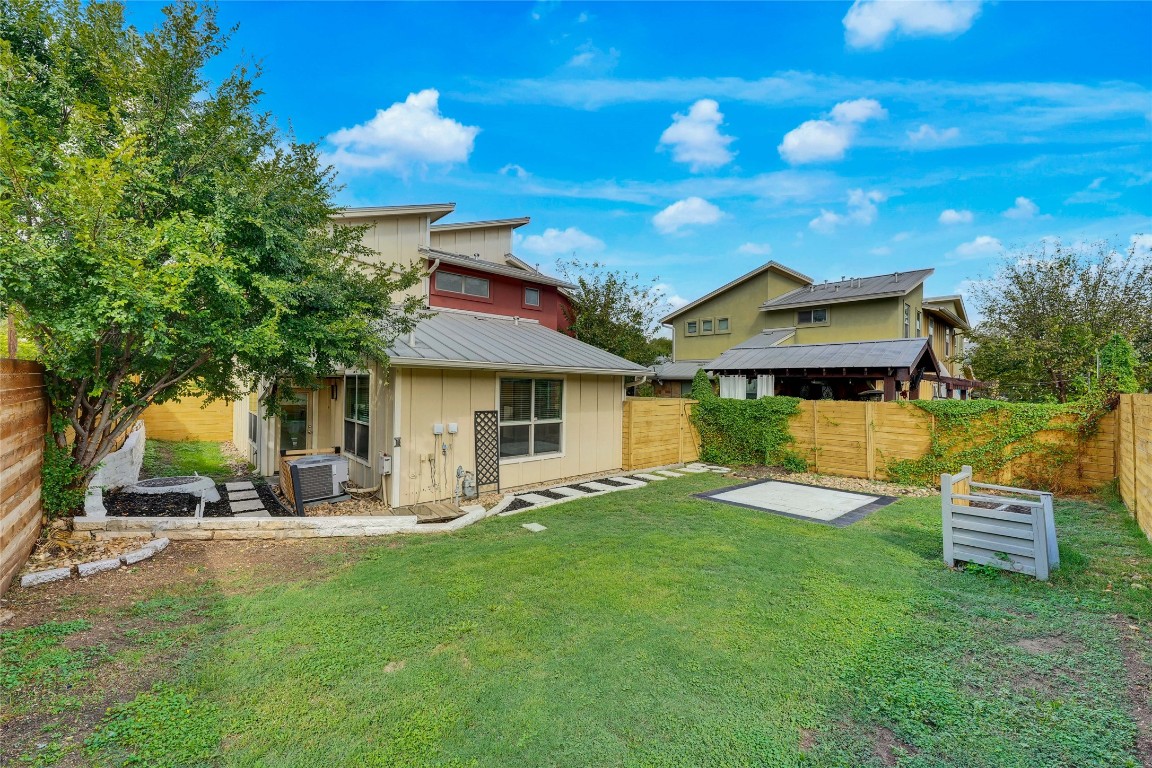 a view of a house with backyard porch and sitting area