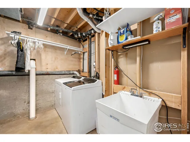a view of a chairs and table in patio with wooden fence