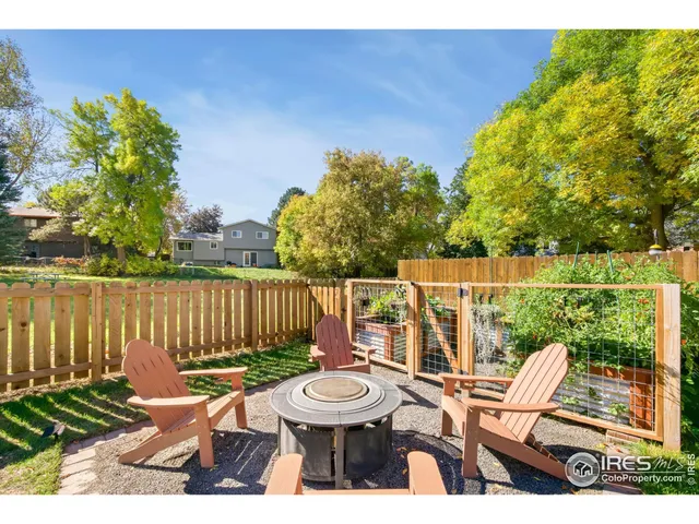 a view of a deck with wooden floor and outdoor seating