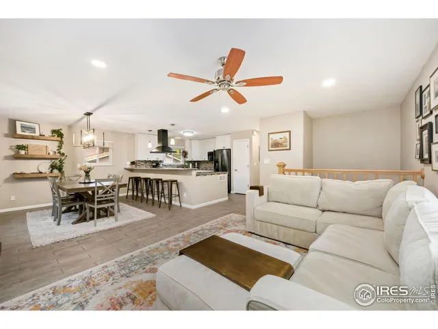 a living room with furniture and a rug