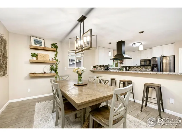 a kitchen with stainless steel appliances kitchen island a refrigerator and a stove
