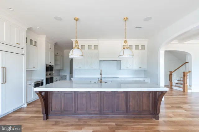 a room with kitchen island granite countertop living room