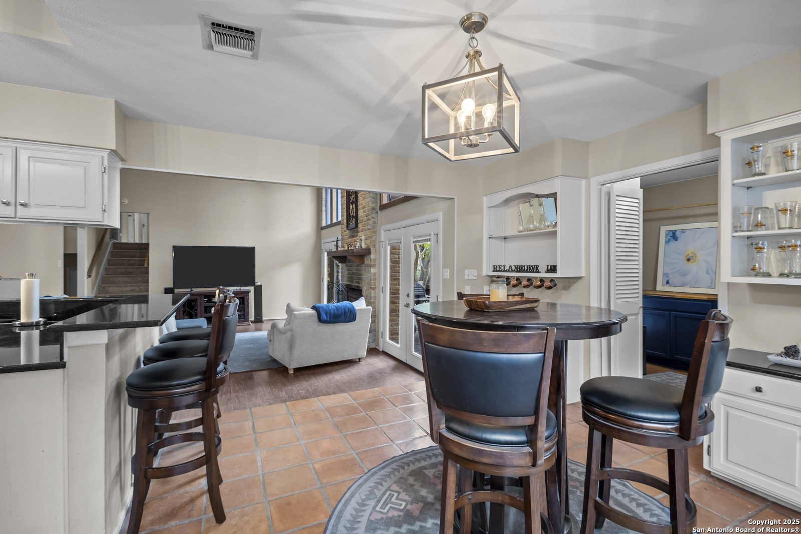 12907 Kings Forest Street San Antonio, TX 78230 - Photo 13 of 44 a kitchen with a dining table and chairs