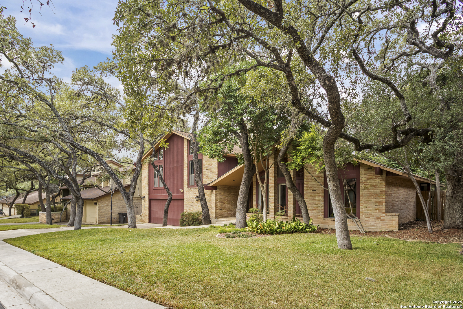 12907 Kings Forest Street San Antonio, TX 78230 - Photo 2 of 44 front view of a house with a yard