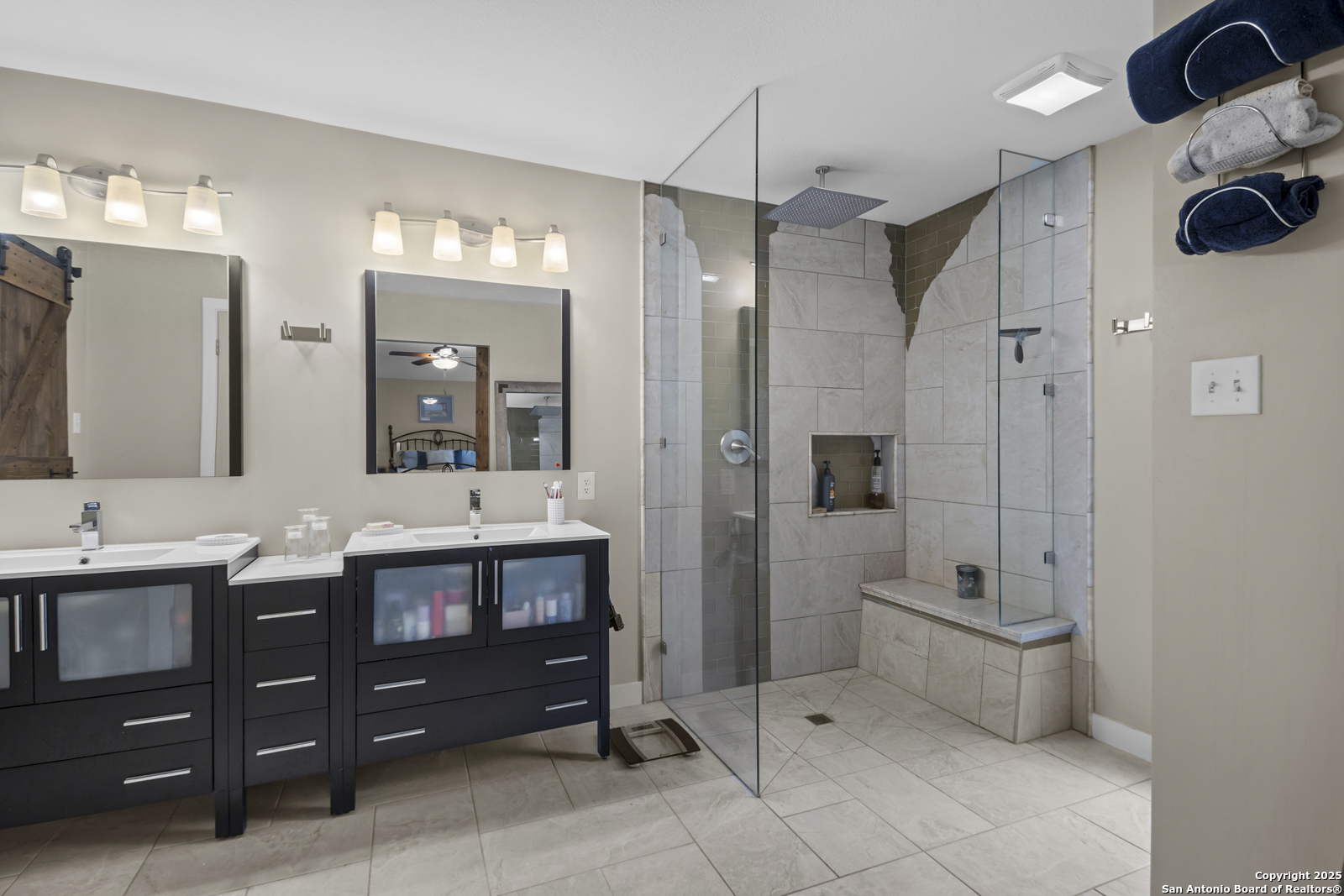12907 Kings Forest Street San Antonio, TX 78230 - Photo 23 of 44 a spacious bathroom with a granite countertop sink mirror and bathtub