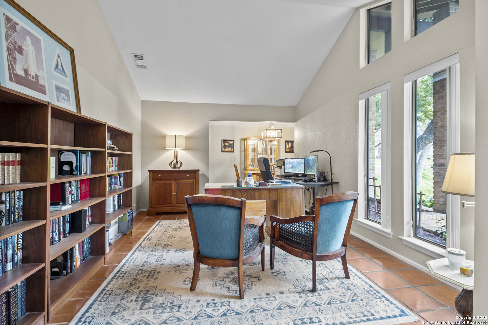 12907 Kings Forest Street San Antonio, TX 78230 - Photo 26 of 44 a dining room with furniture and a book shelf
