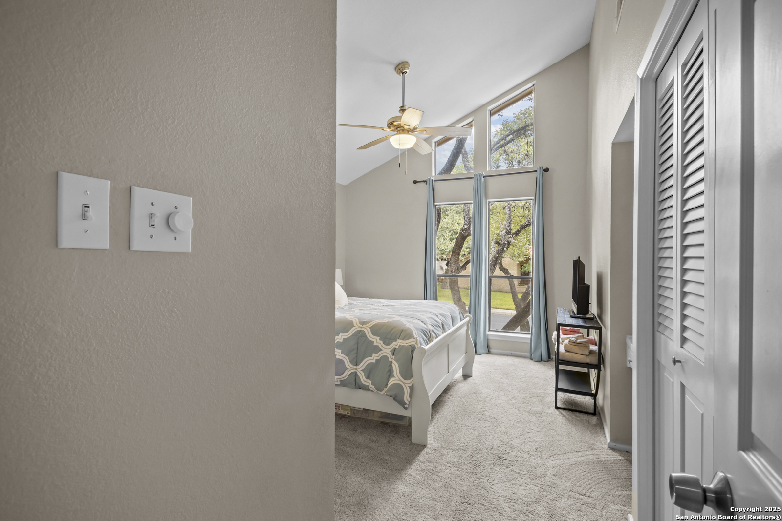 12907 Kings Forest Street San Antonio, TX 78230 - Photo 28 of 44 a bedroom with a bed next to a window