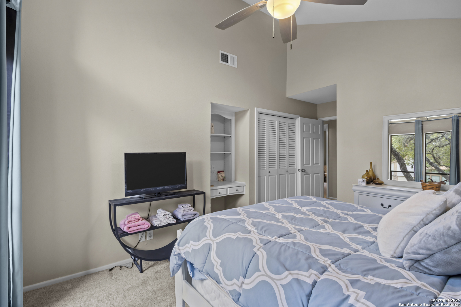 12907 Kings Forest Street San Antonio, TX 78230 - Photo 29 of 44 a bedroom with a bed and glass tv