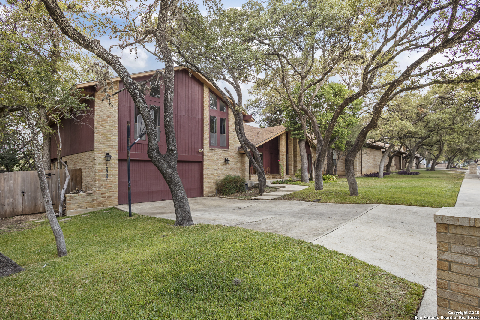 12907 Kings Forest Street San Antonio, TX 78230 - Photo 3 of 44 a view of a house with a yard
