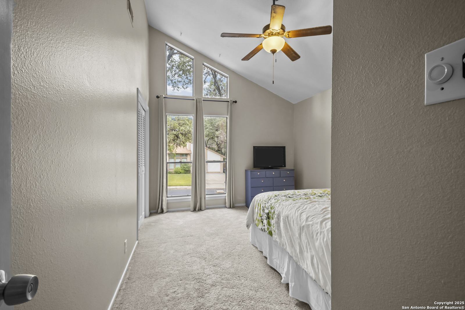 12907 Kings Forest Street San Antonio, TX 78230 - Photo 31 of 44 a bedroom with a bed and a window