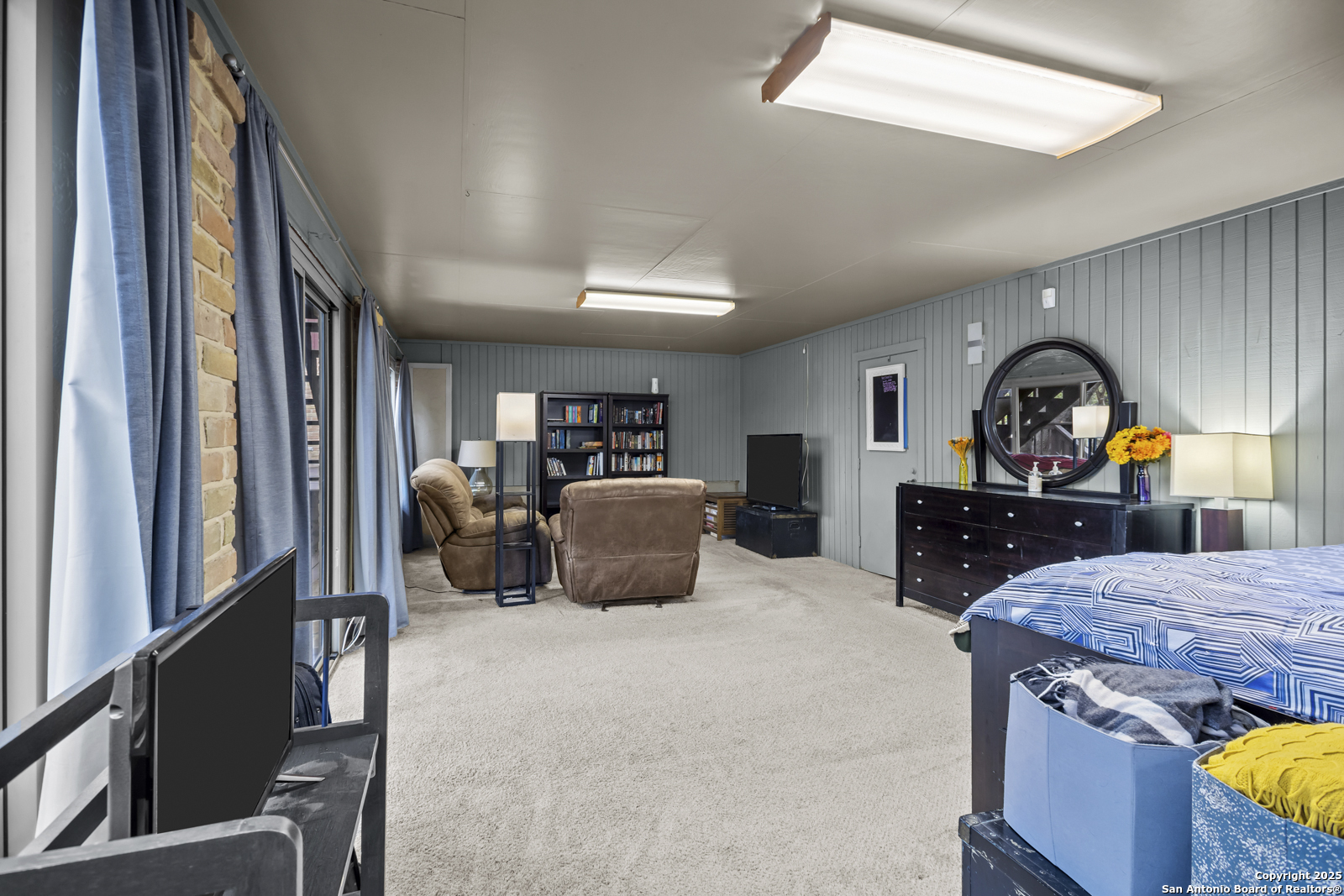 12907 Kings Forest Street San Antonio, TX 78230 - Photo 34 of 44 a bedroom with furniture and a dresser