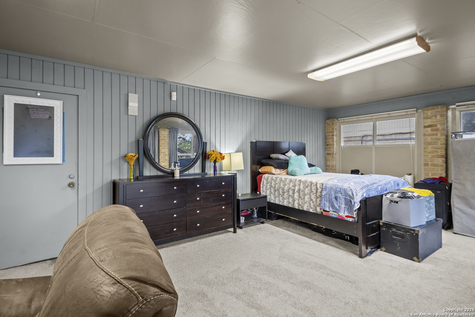 12907 Kings Forest Street San Antonio, TX 78230 - Photo 37 of 44 a bedroom with a bed and window