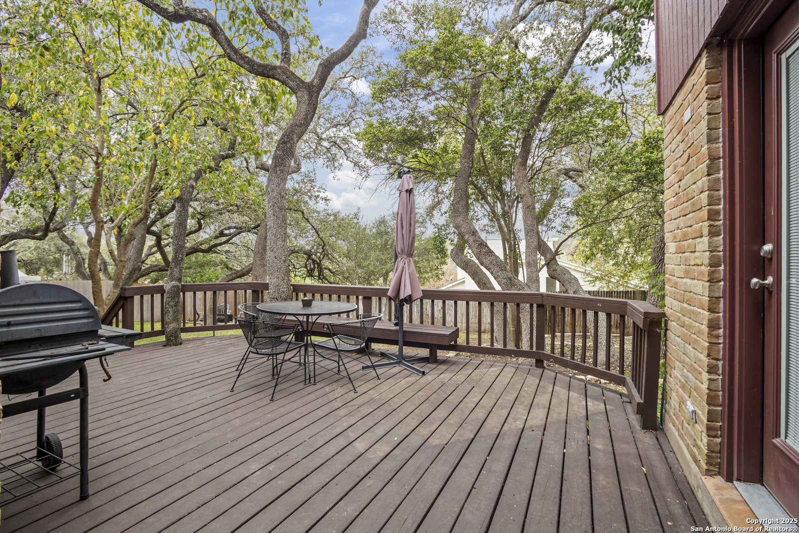 12907 Kings Forest Street San Antonio, TX 78230 - Photo 39 of 44 a view of a wooden deck with furniture