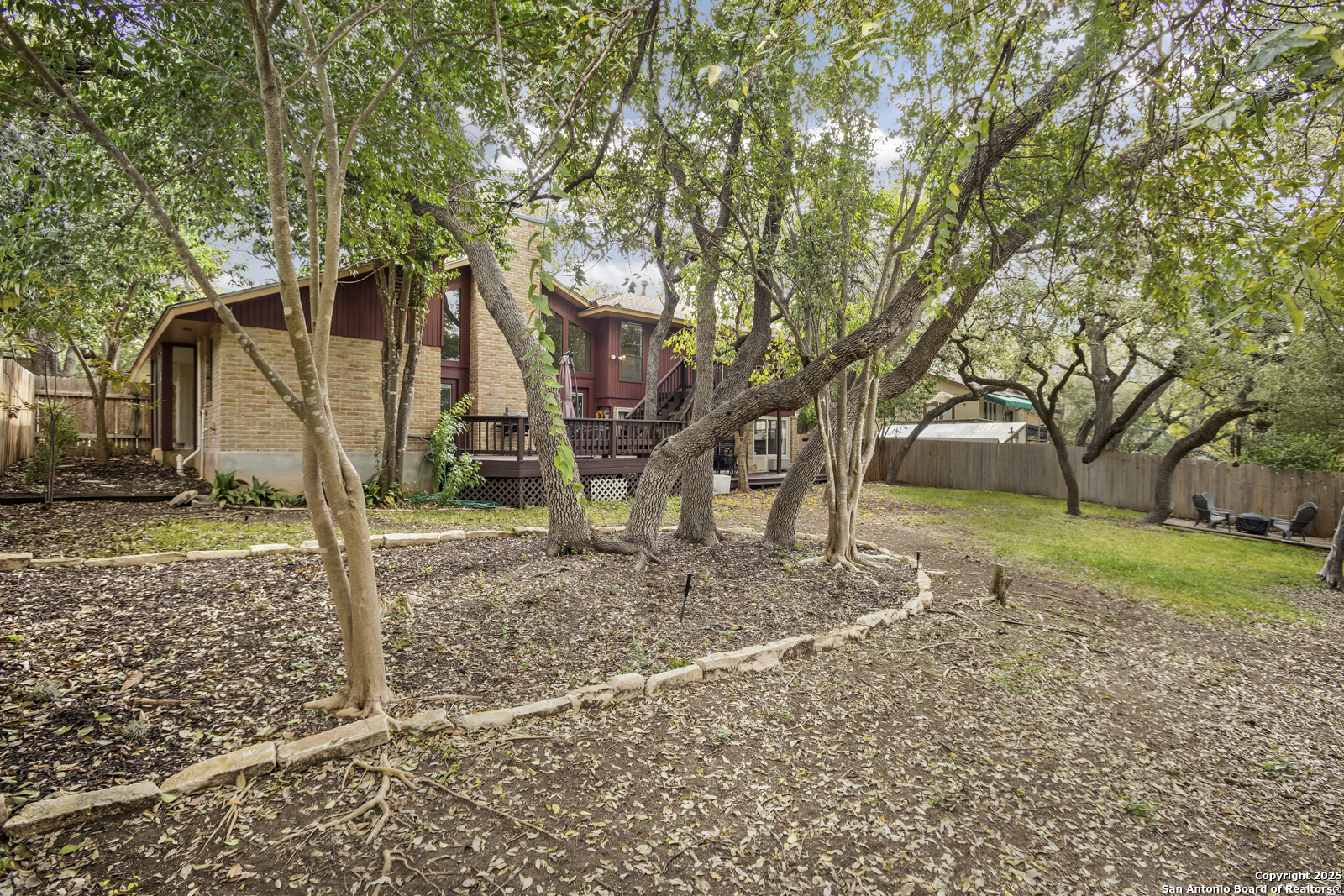 12907 Kings Forest Street San Antonio, TX 78230 - Photo 43 of 44 a view of a house with a yard