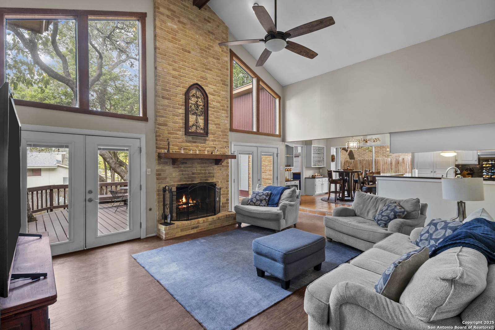 12907 Kings Forest Street San Antonio, TX 78230 - Photo 6 of 44 a living room with furniture large window and fireplace