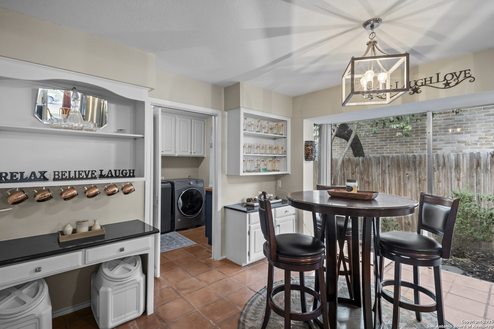 12907 Kings Forest Street San Antonio, TX 78230 - Photo 10 of 44 a view of a dining room with furniture and a chandelier
